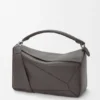 Bolso Puzzle grande en piel de becerro granulada y flexible