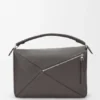 Bolso Puzzle grande en piel de becerro granulada y flexible