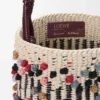 Bolso tipo cubo de cordón, cuero y lana