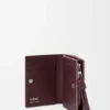 Cartera compacta «Knot» en piel de becerro napa brillante