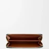 Cartera con cremallera envolvente «Knot» en piel de becerro napa brillante