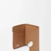 Cartera vertical pequeña «Pebble» de piel de becerro con grano «Pebble»