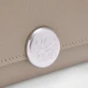 Cartera vertical pequeña «Pebble» de piel de becerro con grano «Pebble»