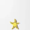 Dado con forma de estrella de mar en piel de becerro