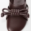 Mules con nudo Flamenco de piel de cordero